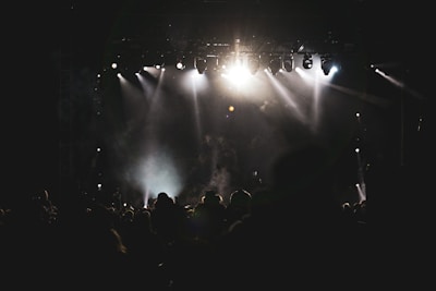 a crowd of people standing on top of a stage