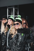 A group of friends wearing matching urban bomber jackets.