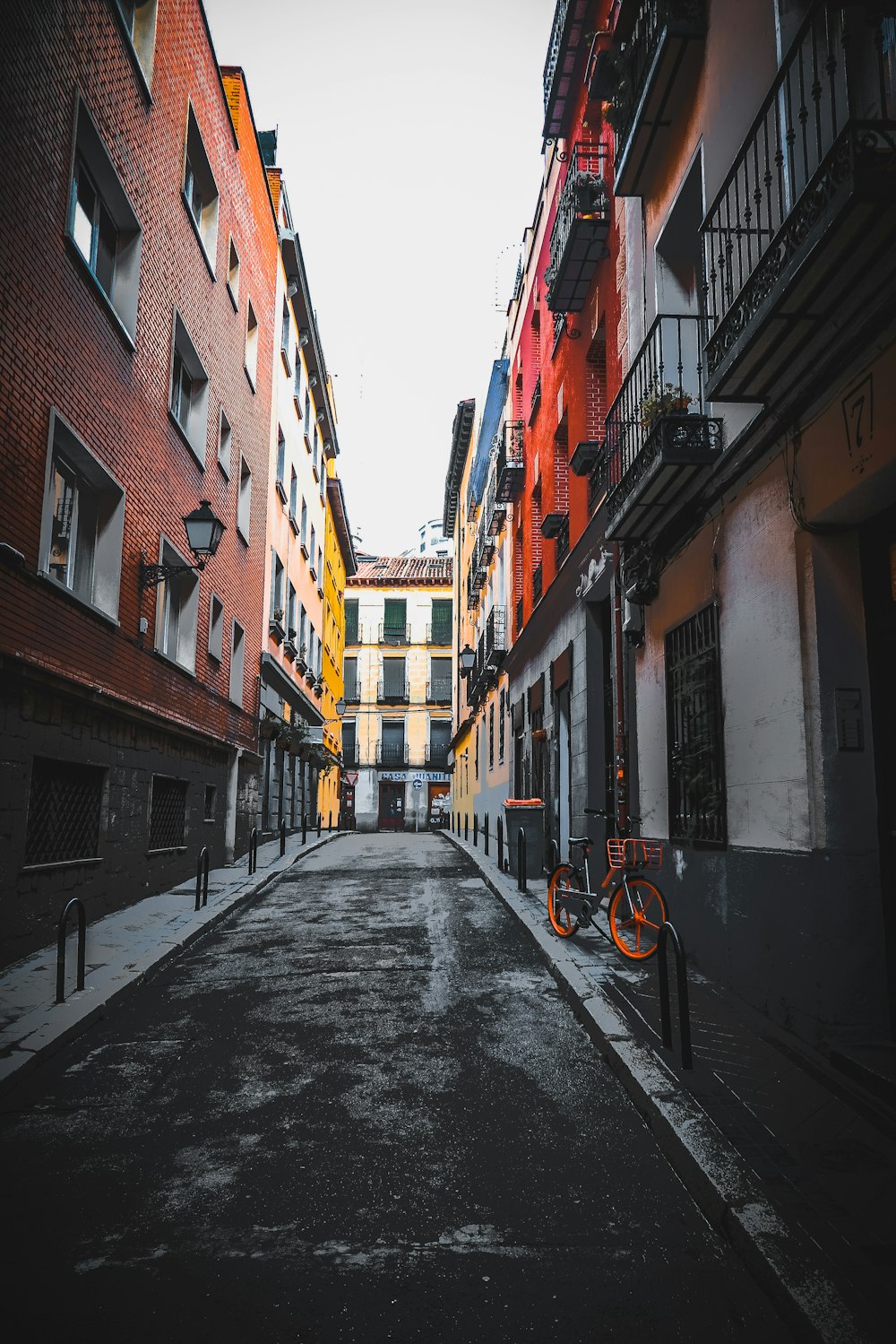 black concrete road between concrete buildings during daytime