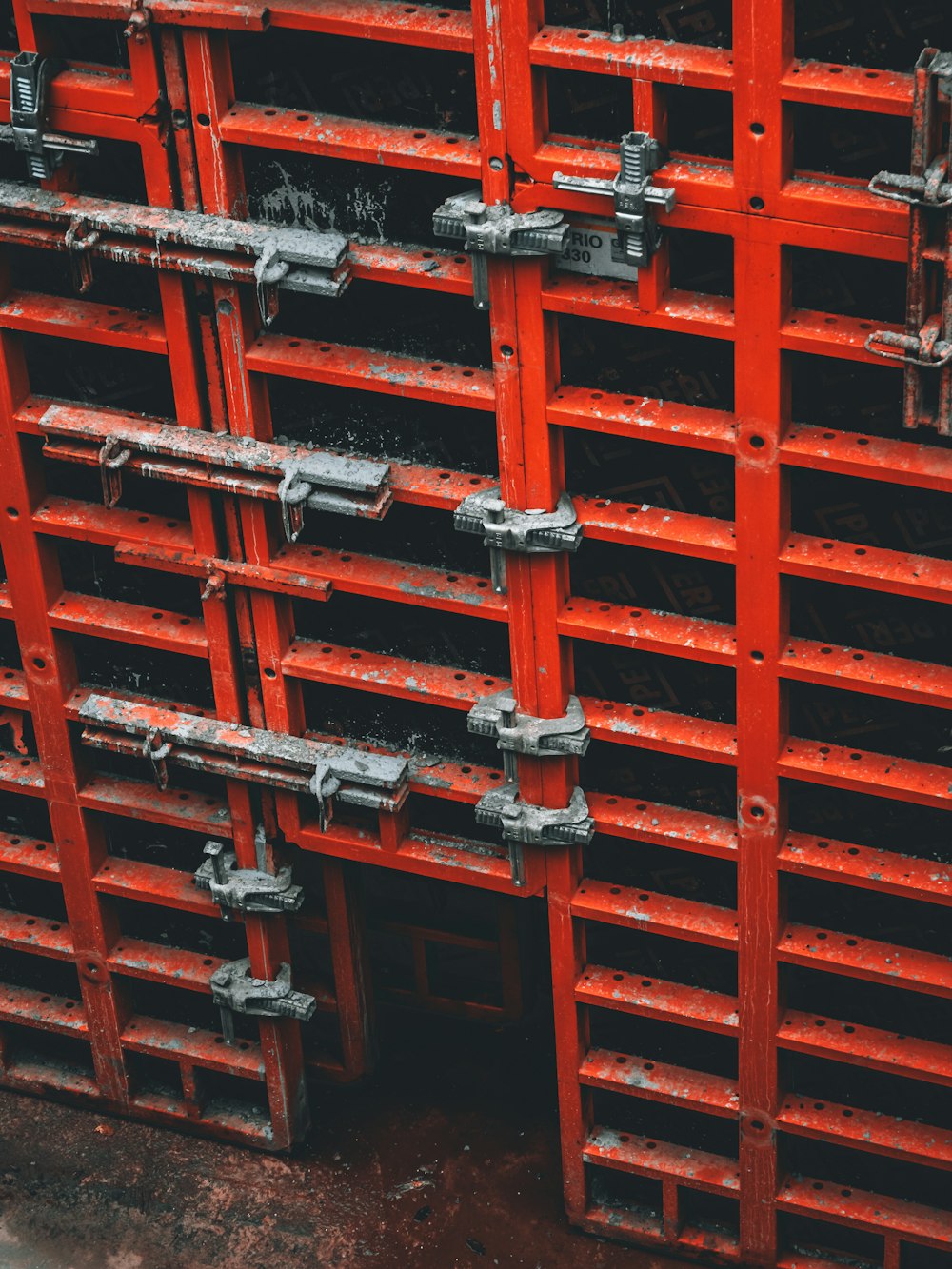 red metal door with stainless steel door lever