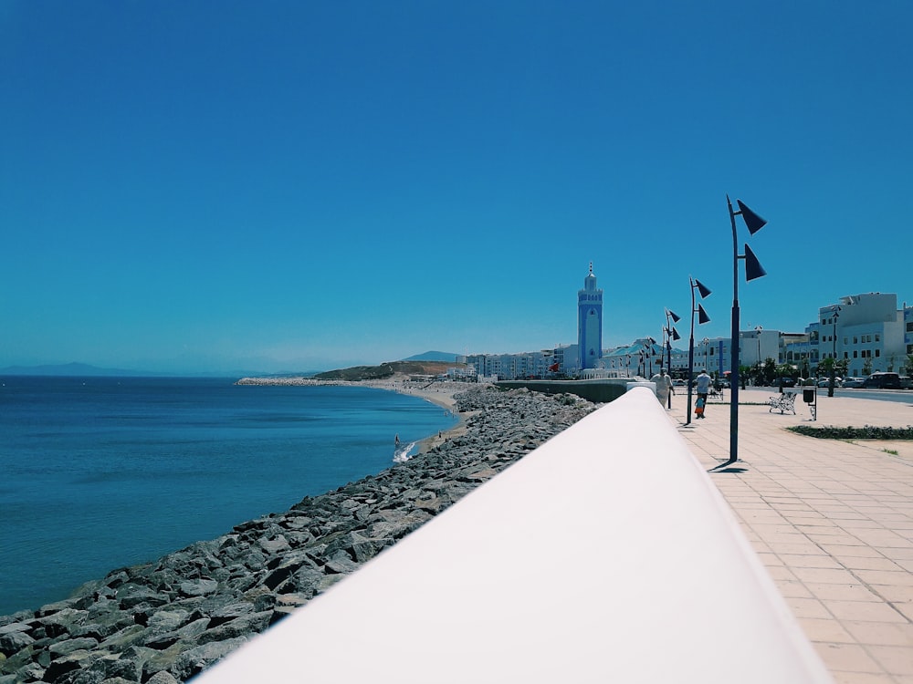 people walking on the beach during daytime