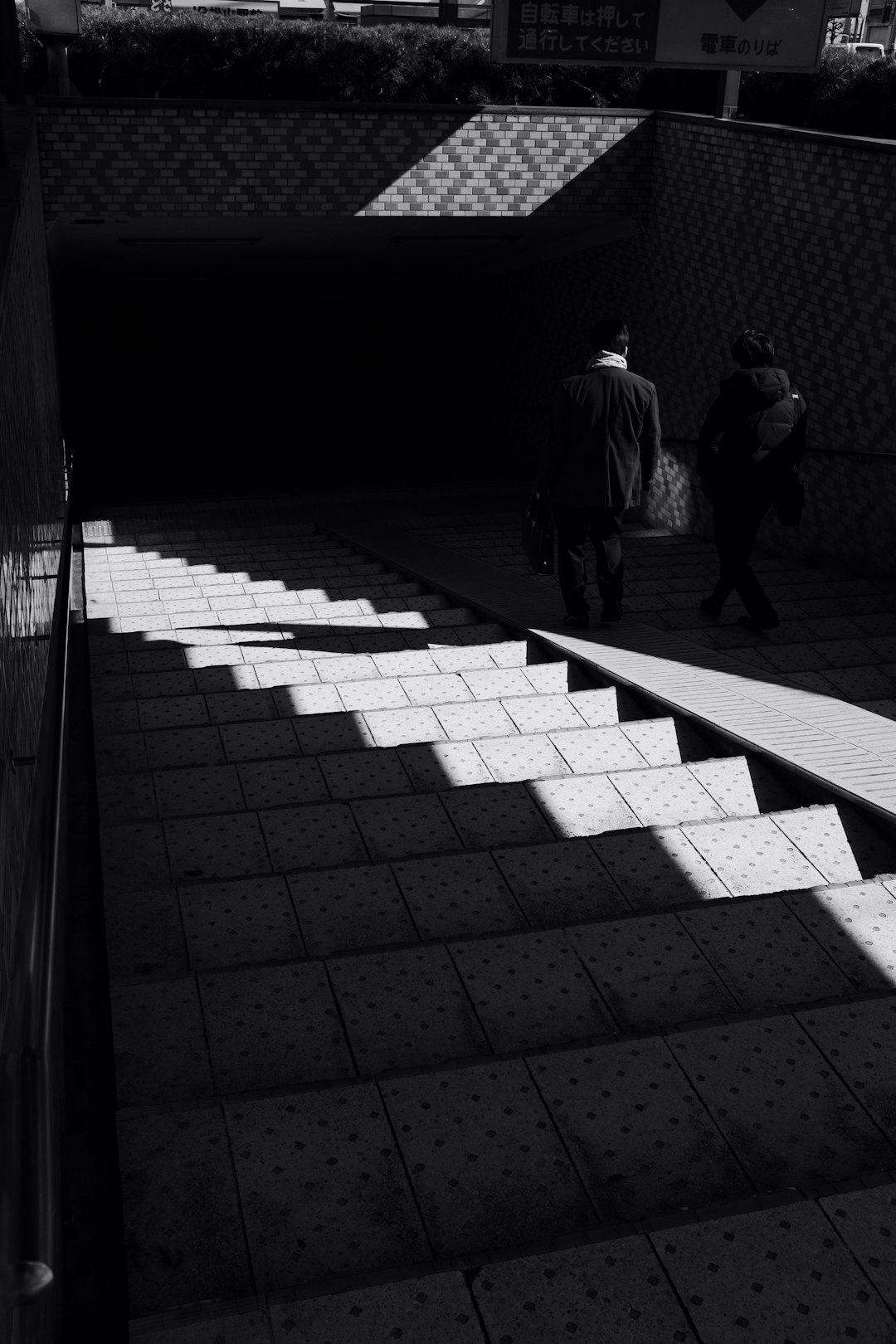 man and woman walking on the hallway