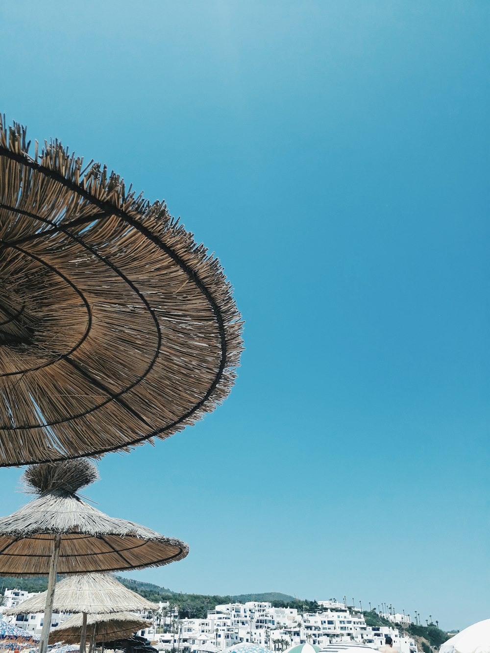 brown wooden round roof under blue sky during daytime