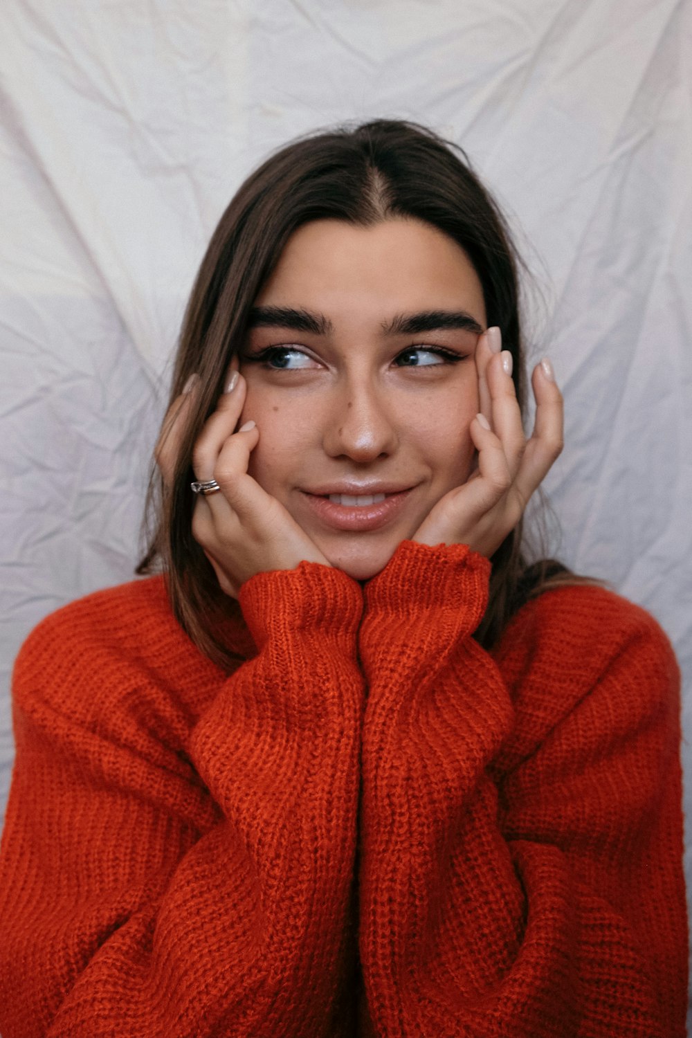 woman in red knit sweater