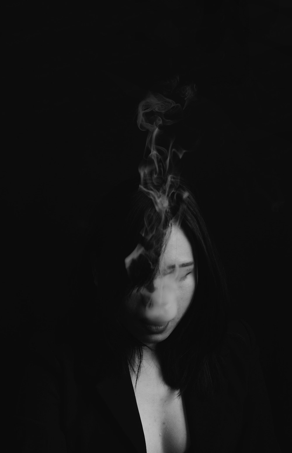 grayscale photo of woman smoking