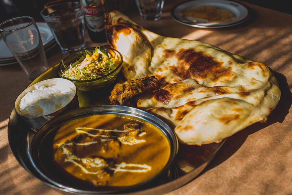 Image result for amazing curry with naan in stainless steel