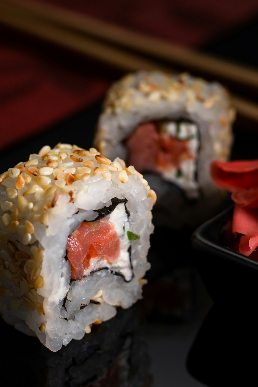 white rice with red sauce on black ceramic plate