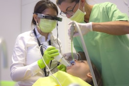 Group of dental professionals collaborating during a hands-on implantology workshop.