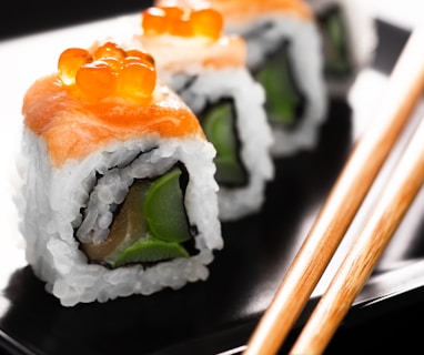 sushi on black ceramic plate