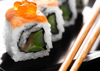 sushi on black ceramic plate