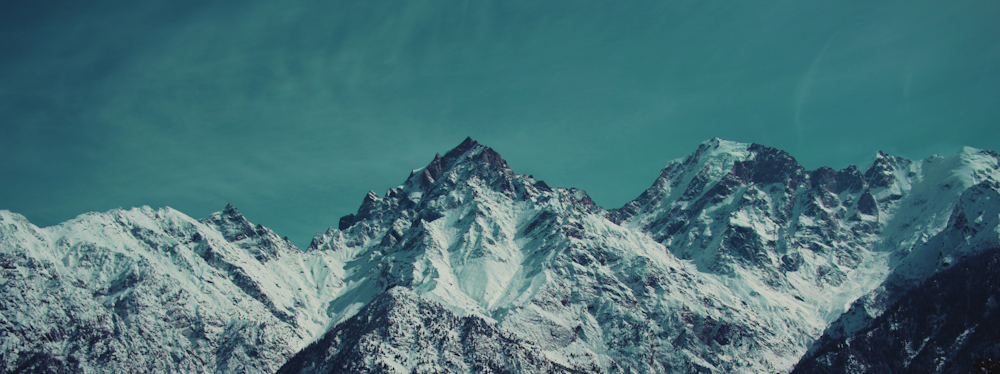 snow covered mountain under blue sky during daytime