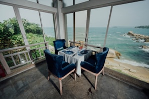 Dining area with table set for two guests.