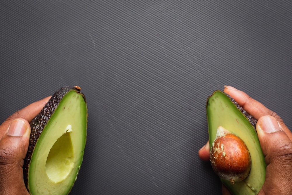 sliced green fruit on black textile