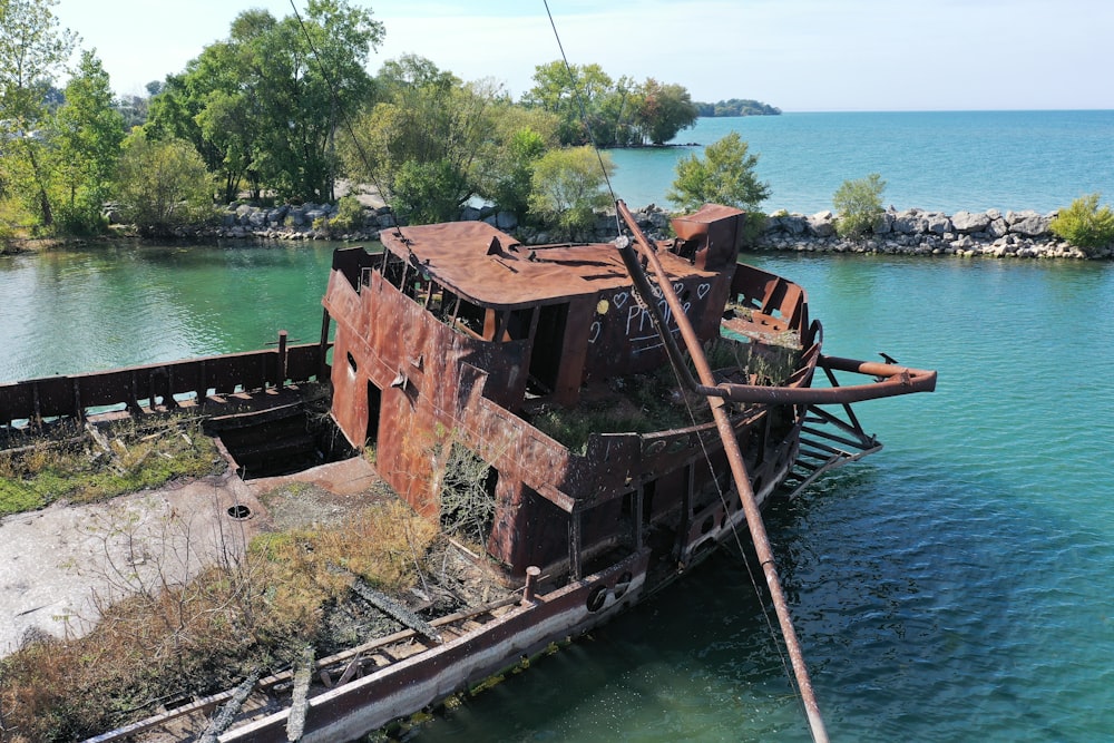 brown and black ship on body of water during daytime