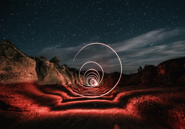 A fantasy landscape with sparkling stars and mystical creatures around a slot game interface.