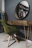 Close-up of a sleek LED mirror with golden frame in a stylish dressing room