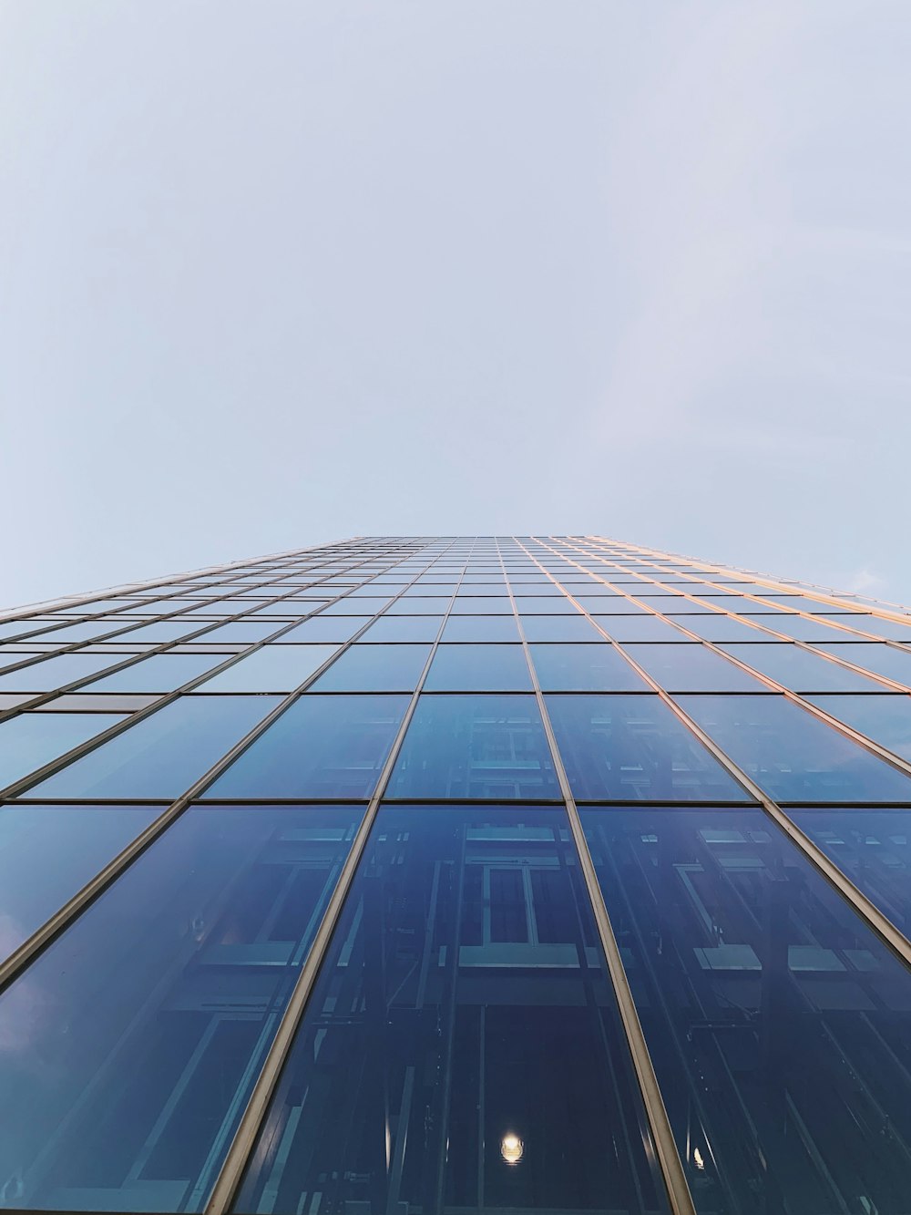 low angle photography of glass building