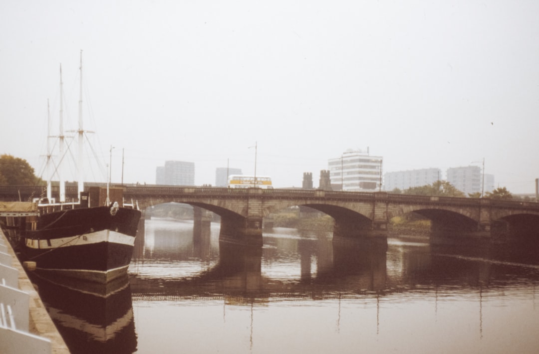 brown concrete bridge over river during daytime