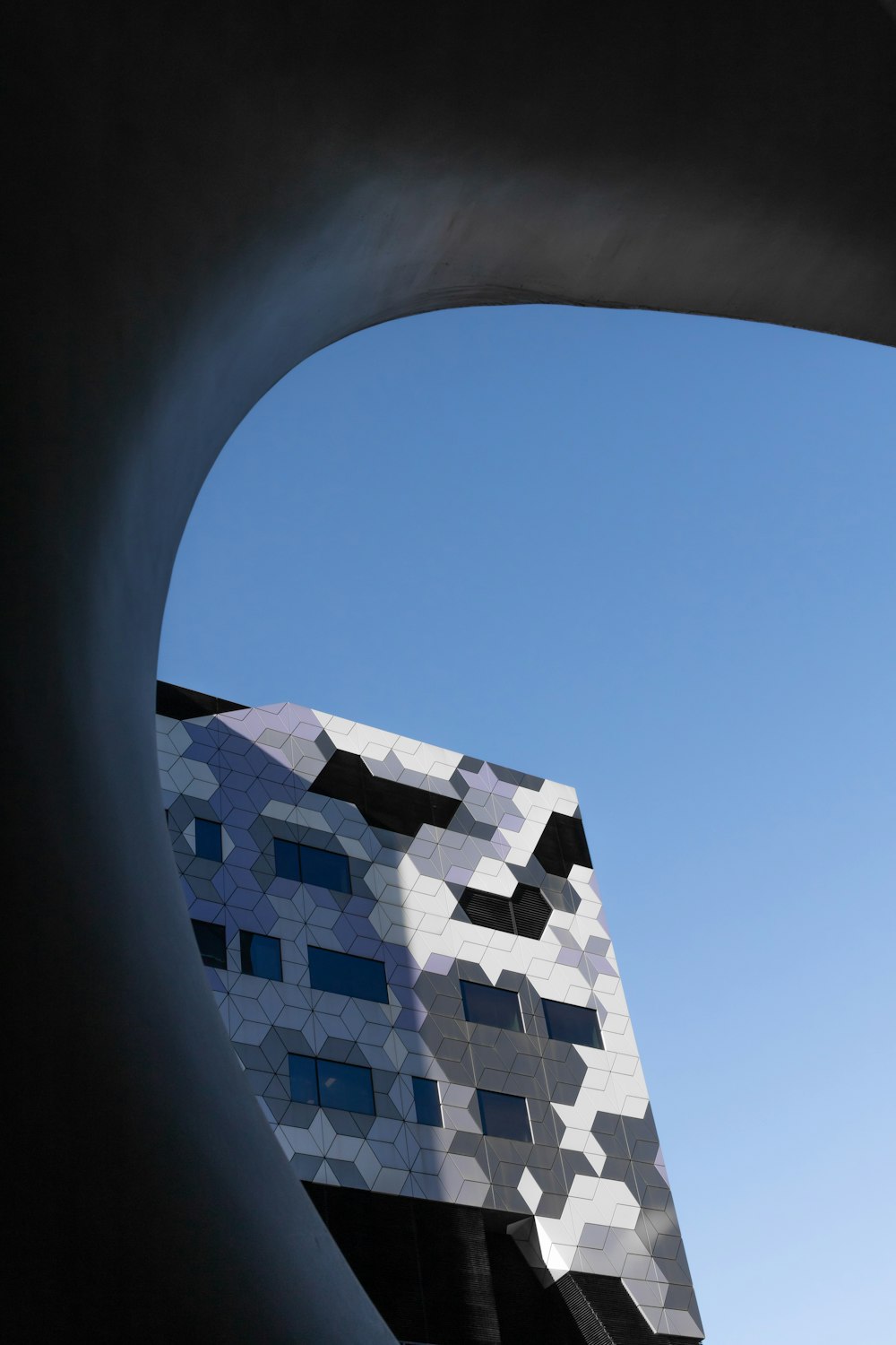 white and blue concrete building under blue sky during daytime