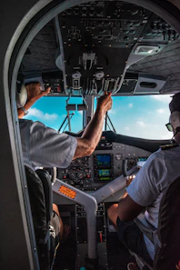 man in blue shirt driving car during daytime