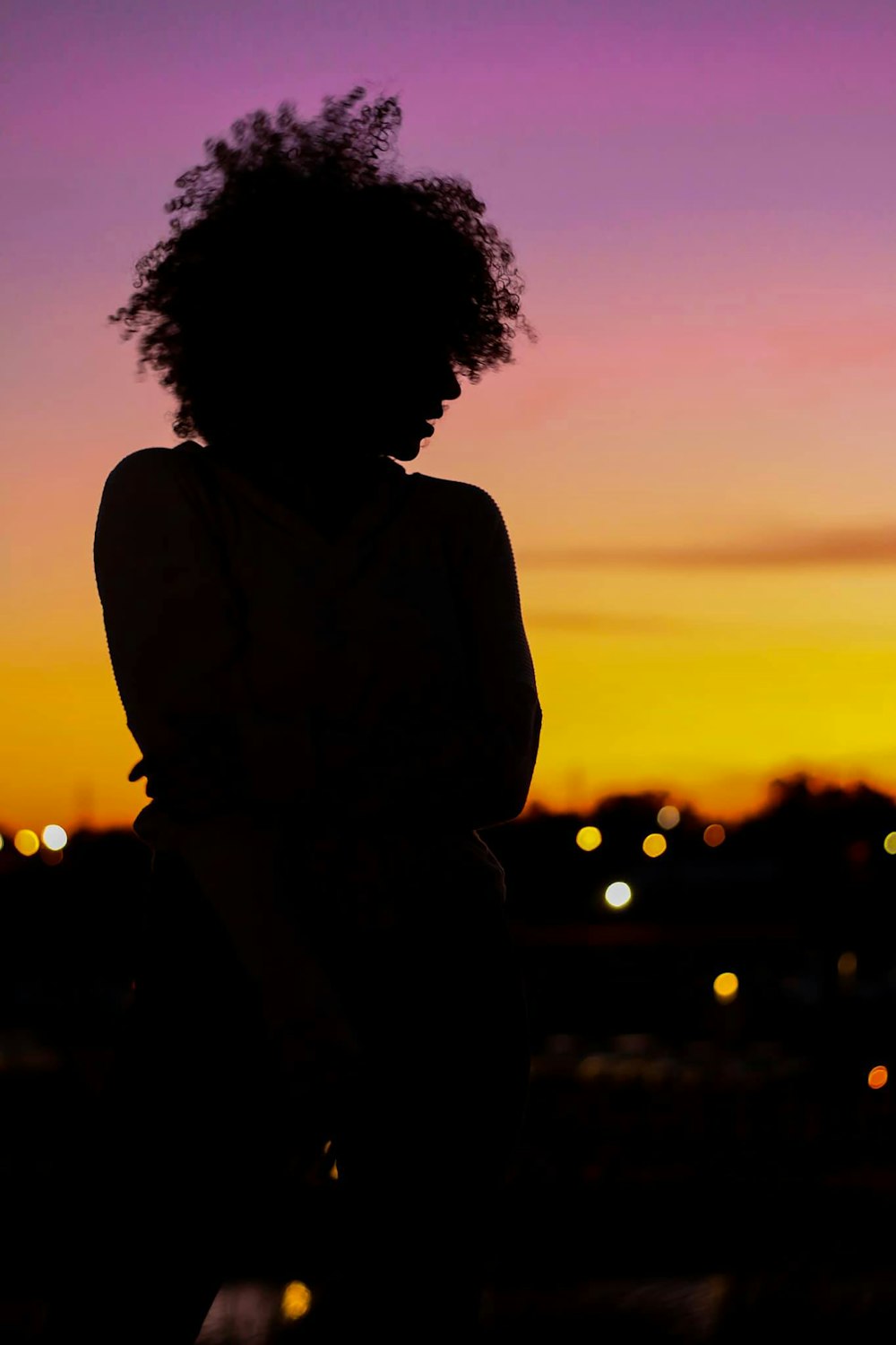 silhouette of man standing during sunset