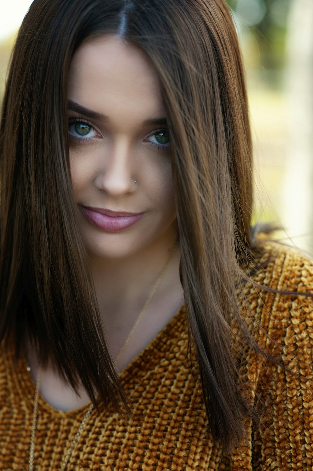 woman in brown knit shirt