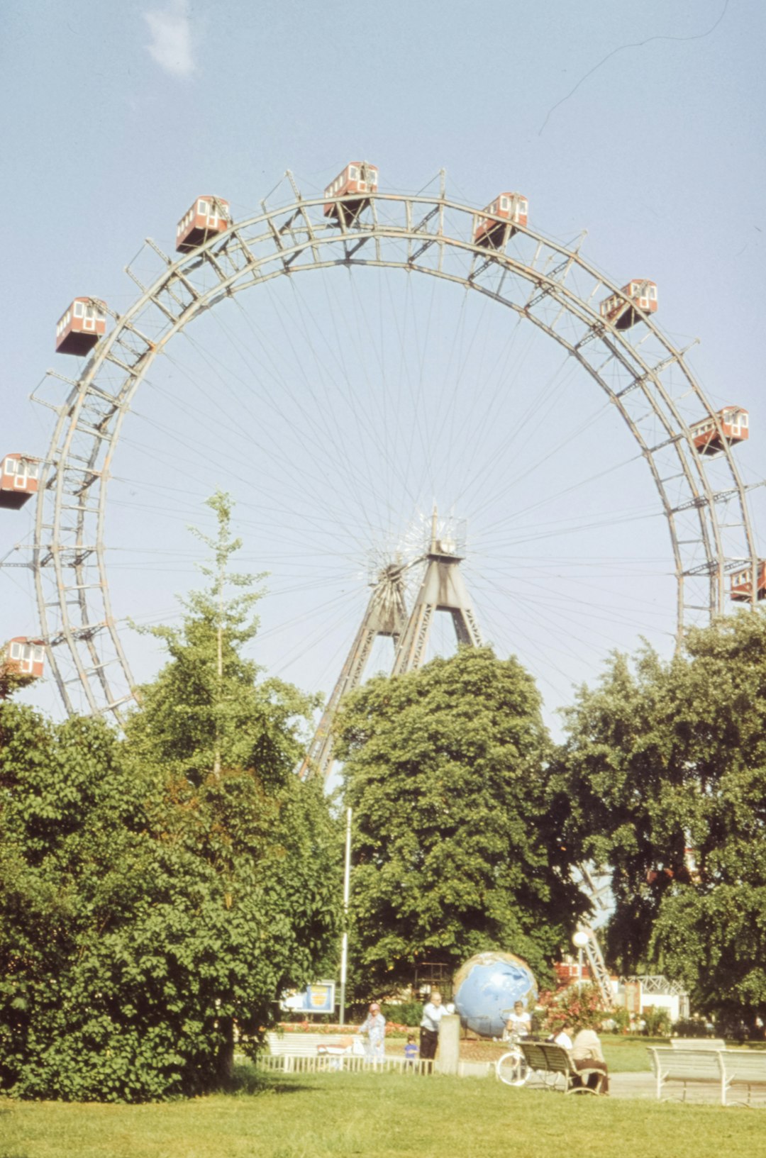 people riding roller coaster during daytime