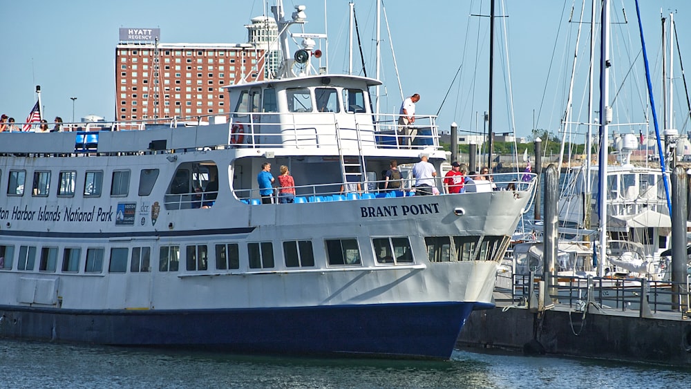 white and blue ship on sea during daytime