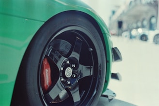 A car being detailed with a focus on the wheels.
