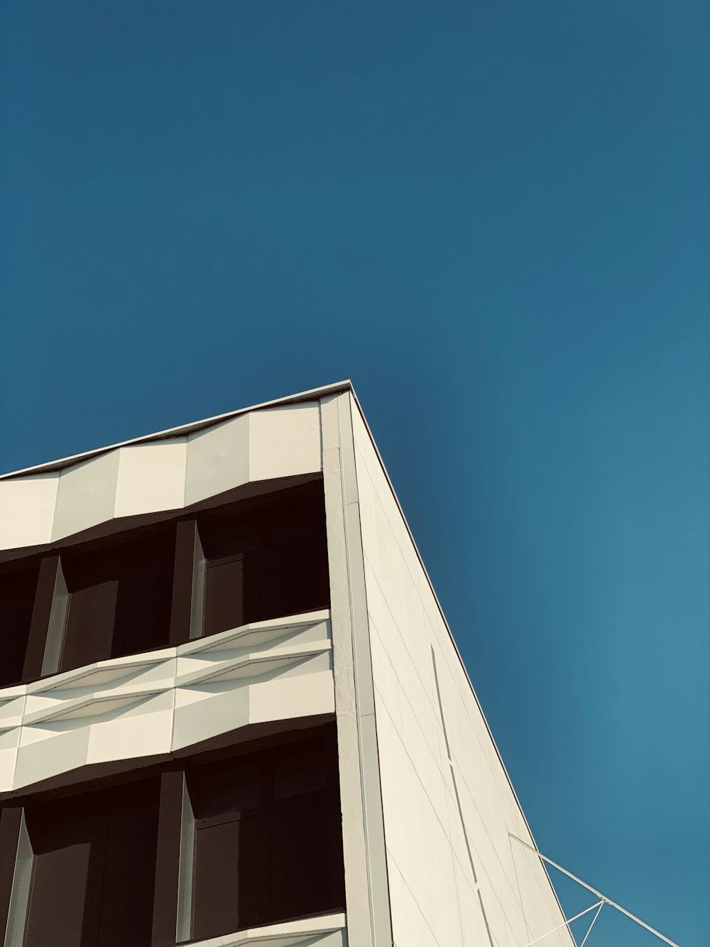 white concrete building under blue sky during daytime