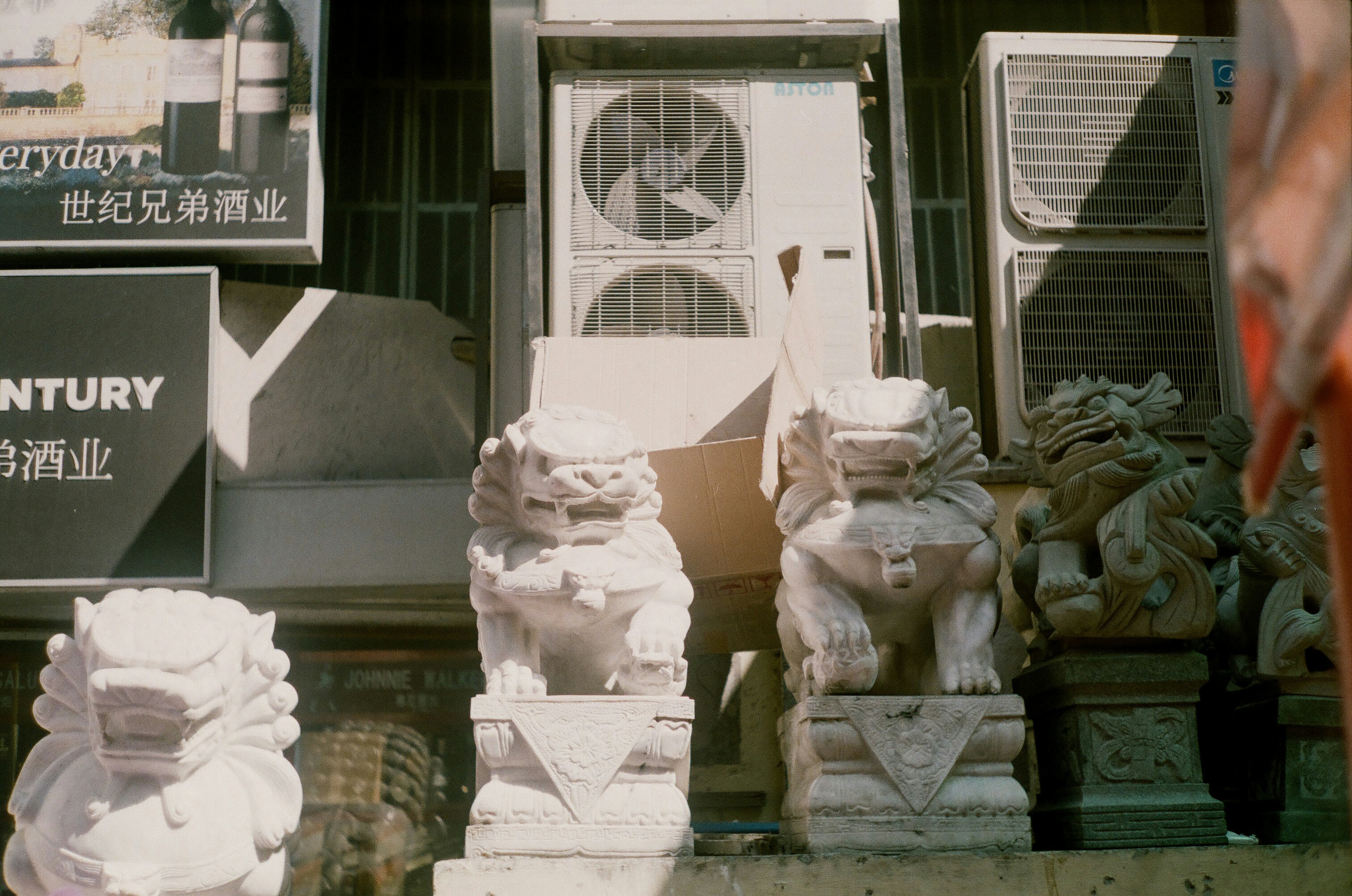 white concrete statue on gray concrete floor