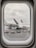 Raindrops cover an airplane window, through which a parked airplane with visible engines and a partially obscured emblem on the tail is seen on the wet tarmac. Ground handling equipment and a person in high-visibility clothing are visible near the aircraft.