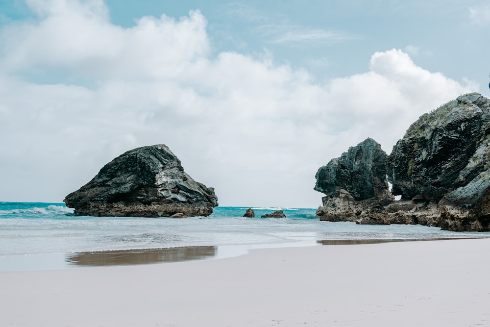 gray rock formation on sea shore during daytime