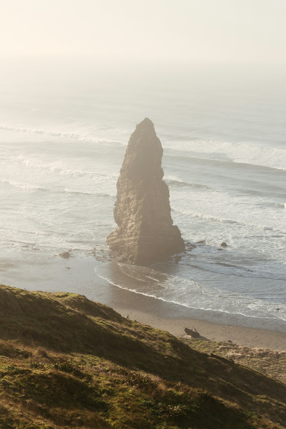 brown rock formation on sea shore during daytime