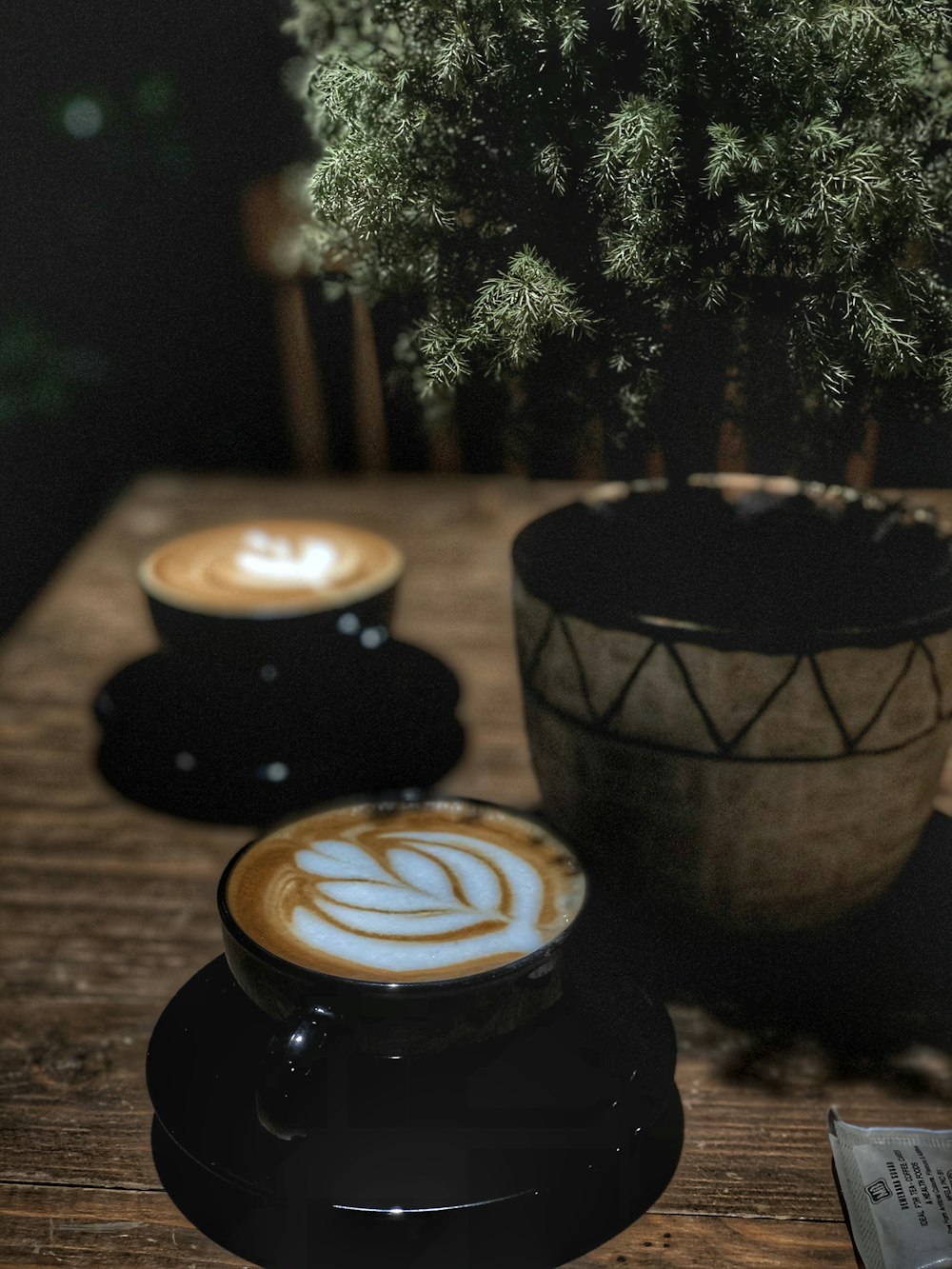 black and white ceramic cup with cappuccino