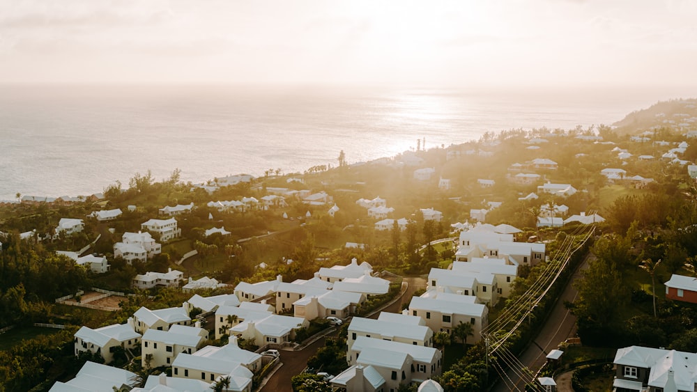 white houses near body of water during daytime