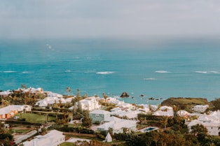 houses near sea during daytime