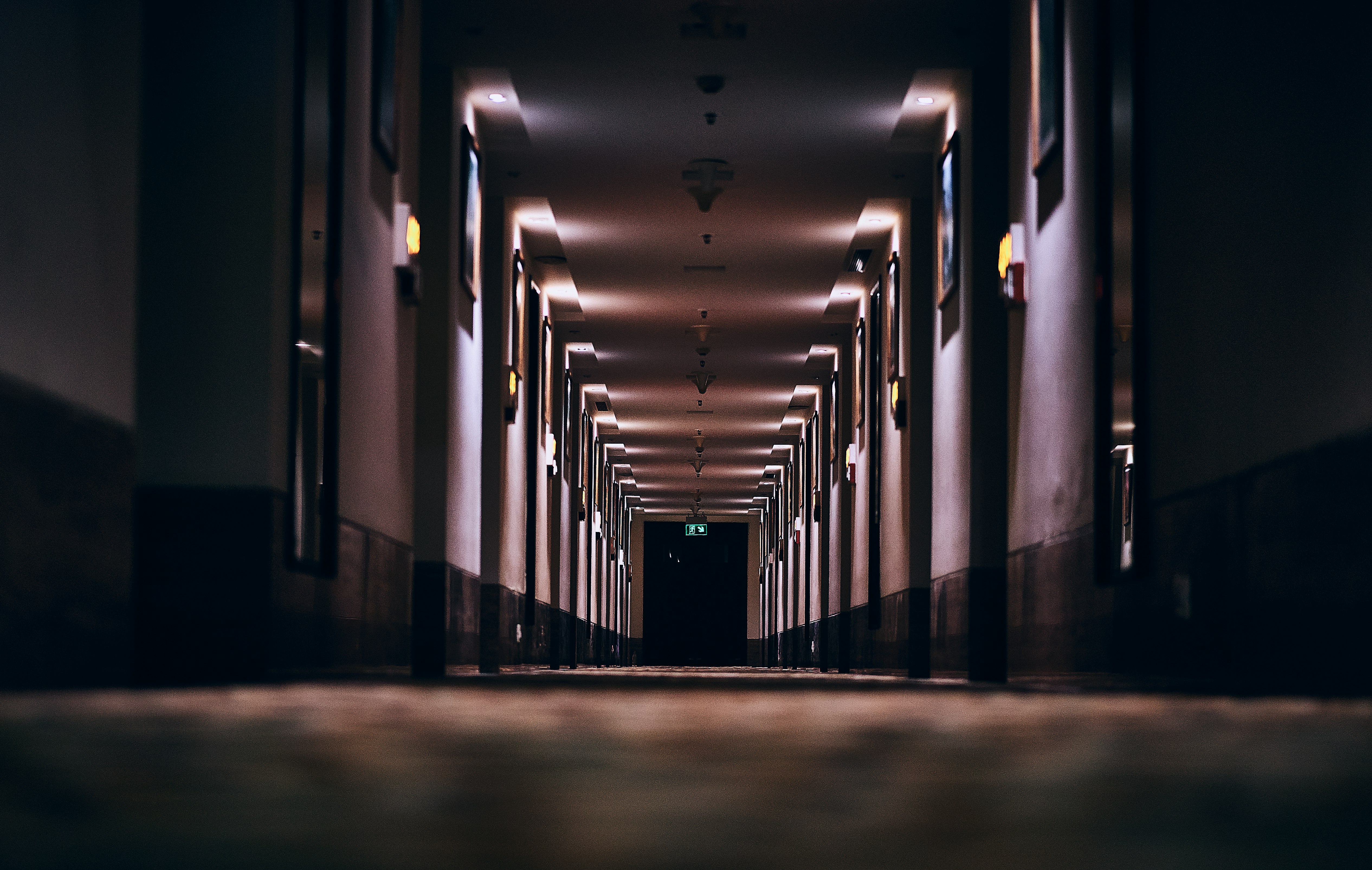 hallway with lights turned on in a hallway