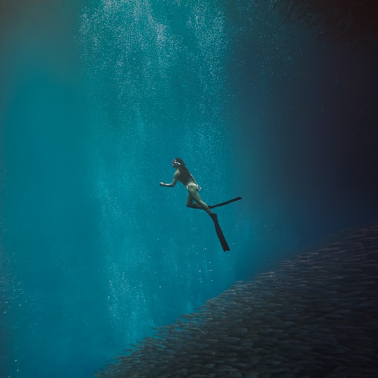 man in black shorts swimming in water in Cebu Philippines