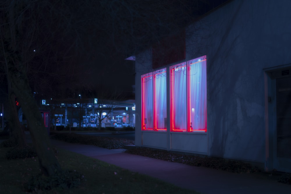 white and pink lighted building during night time