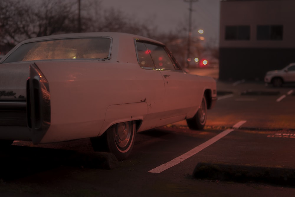 white classic car on road during daytime