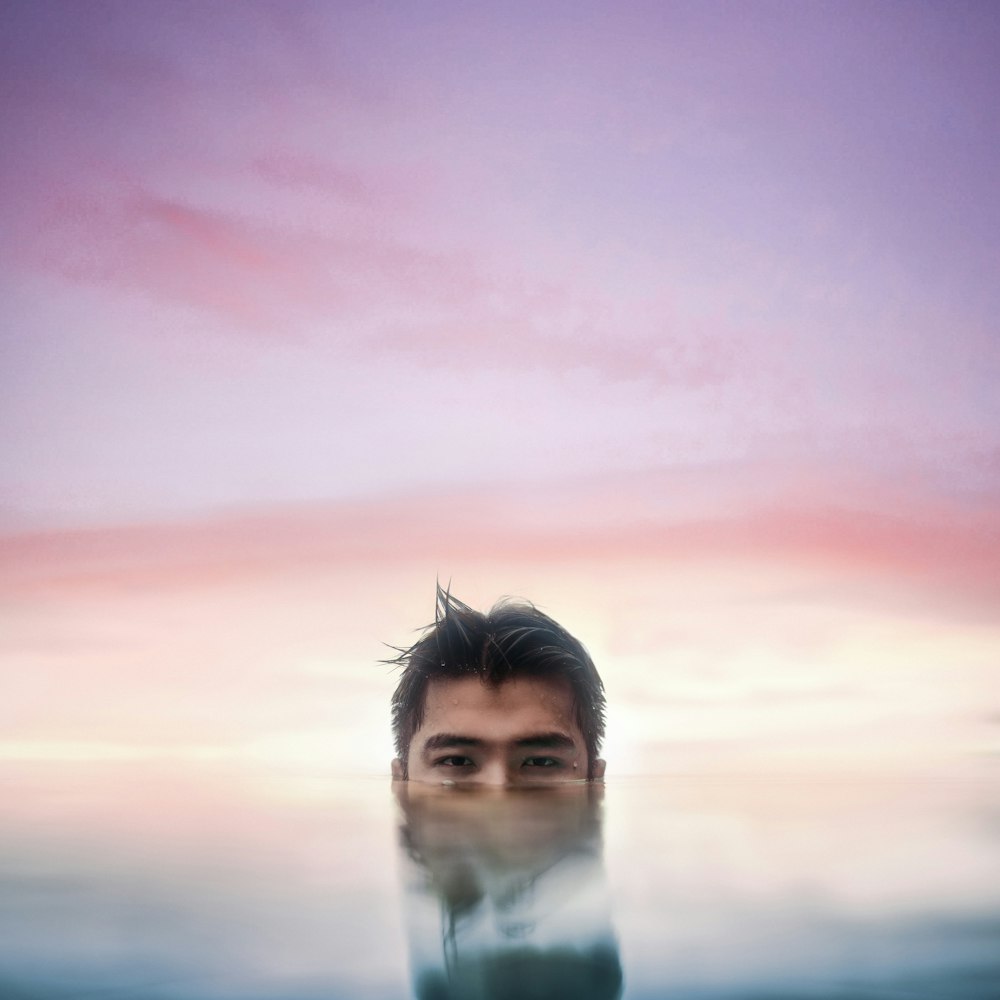 woman in white shirt under cloudy sky during daytime