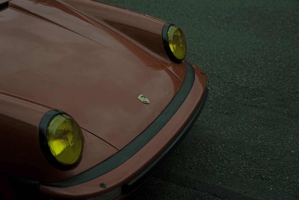 orange ferrari car on road during daytime