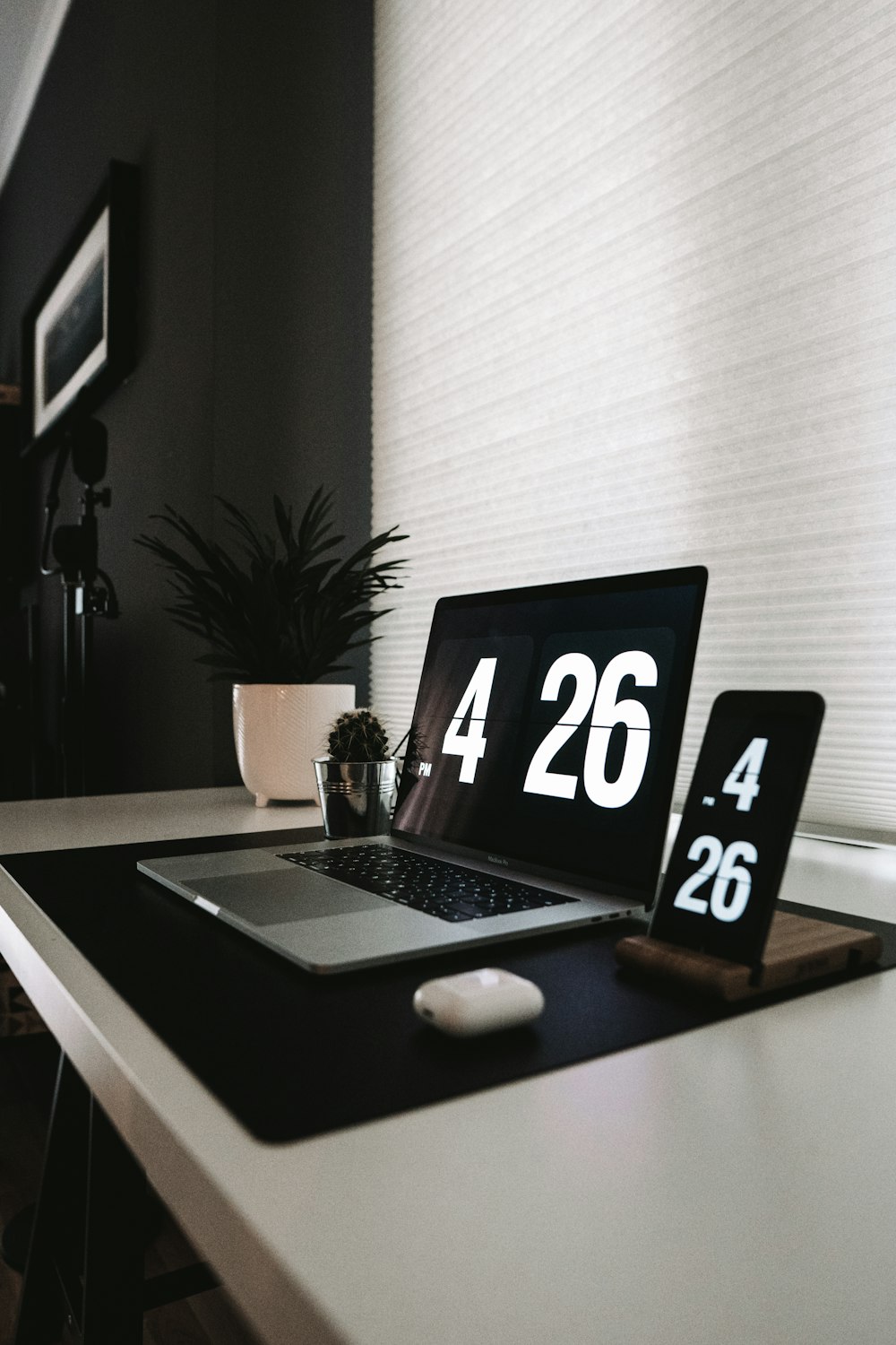 black and white laptop computer on brown wooden table