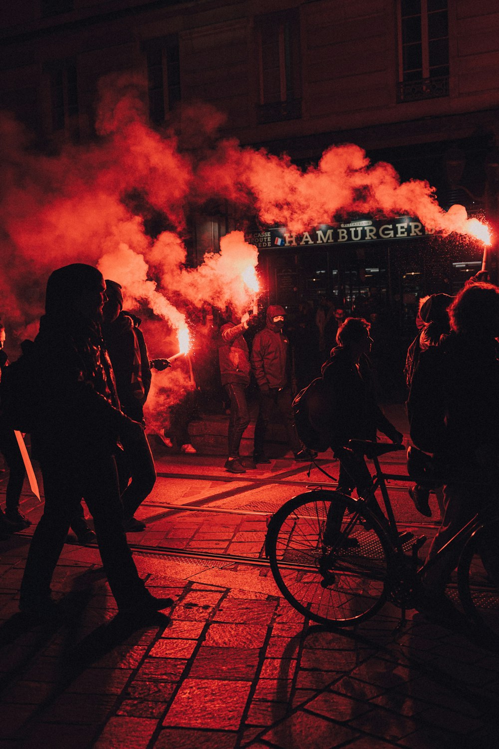 people standing on street during night time