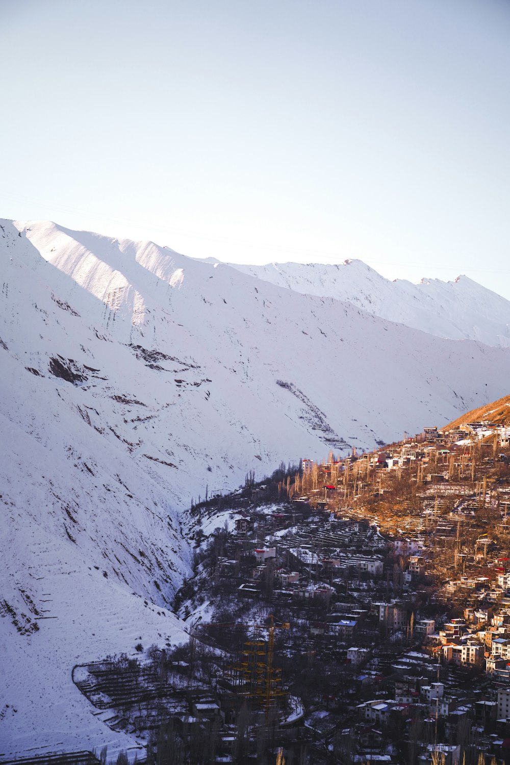 snow covered mountain during daytime