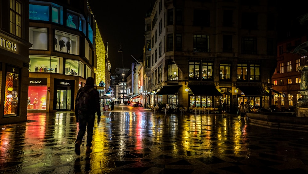 people walking on street during night time