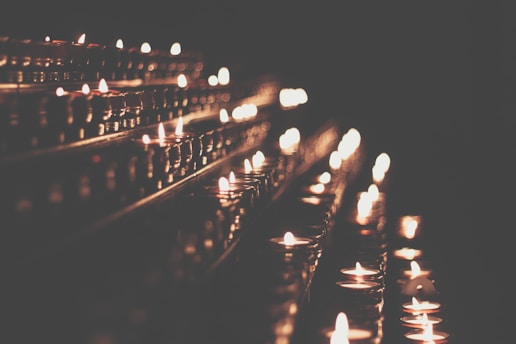 A warm, elegant space with candles and golden light, inviting deep soulful reflection.