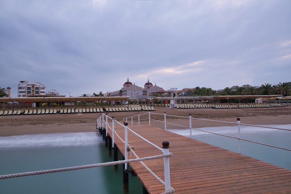 people walking on bridge over river during daytime