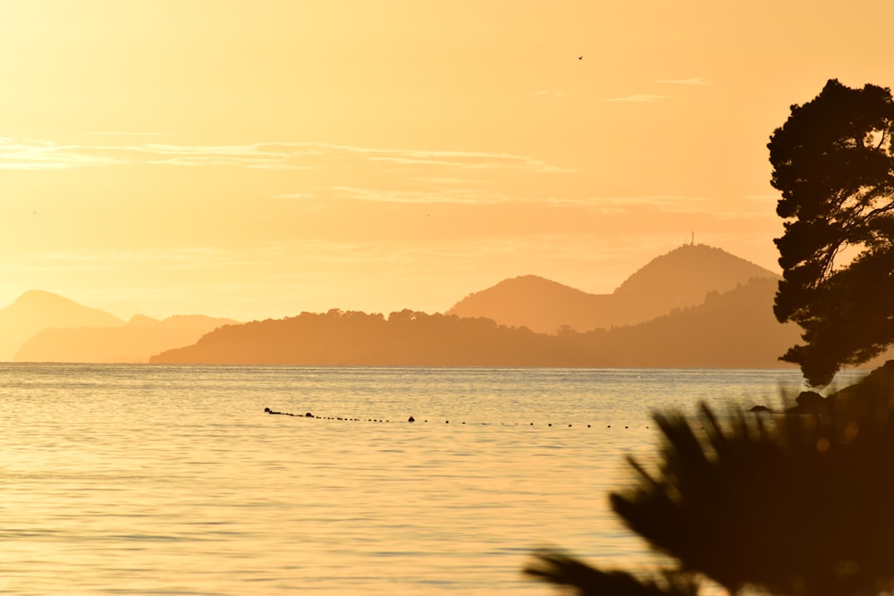 silhouette of mountains during sunset